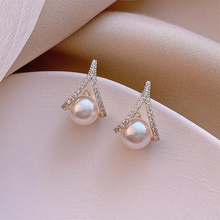 Parel oorbellen met diamanten